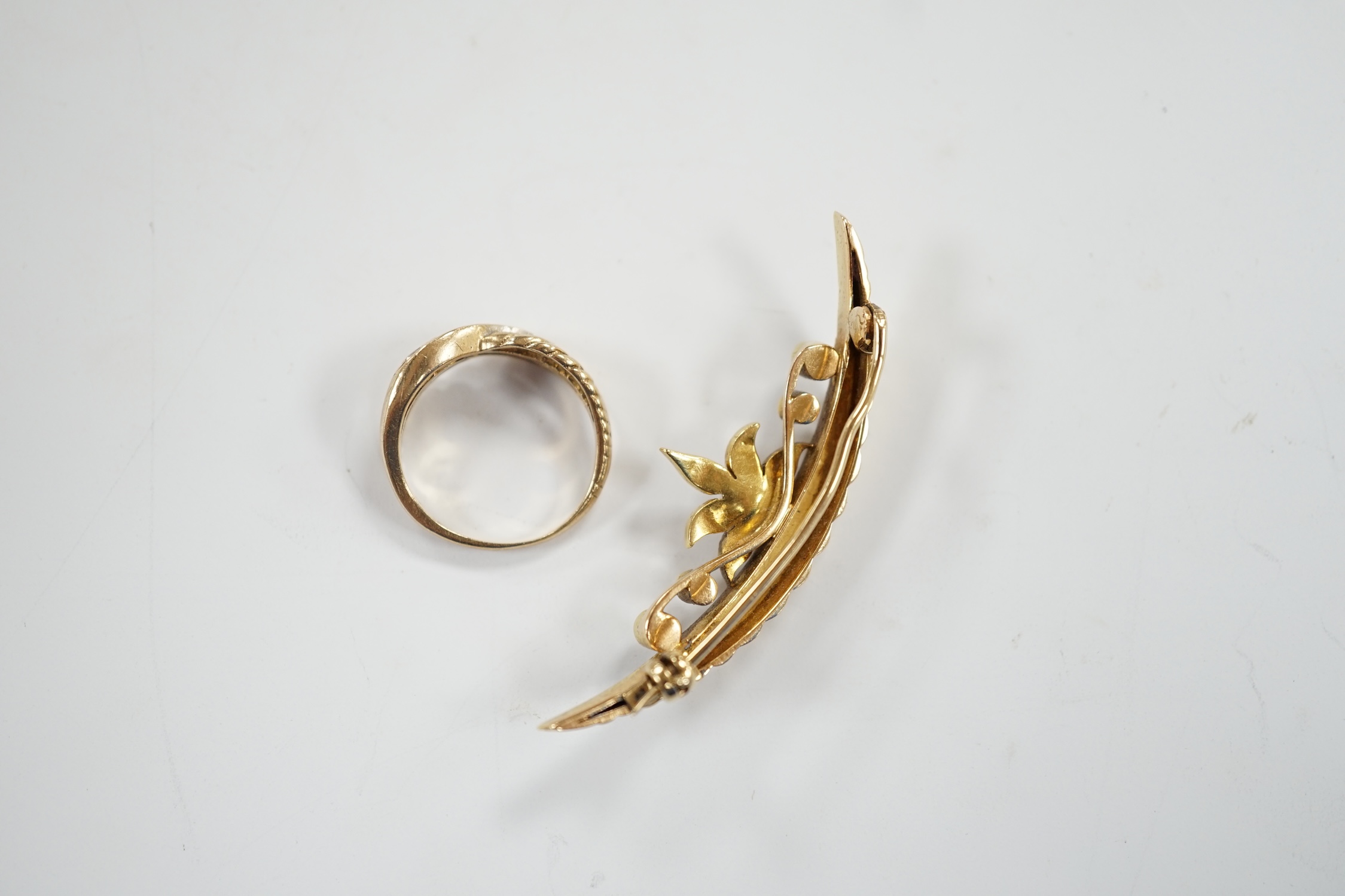 A yellow metal and seed pearl cluster set crescent shaped brooch, 48mm and a 9ct gold and cubic zirconia set ring, gross weight 10 grams.